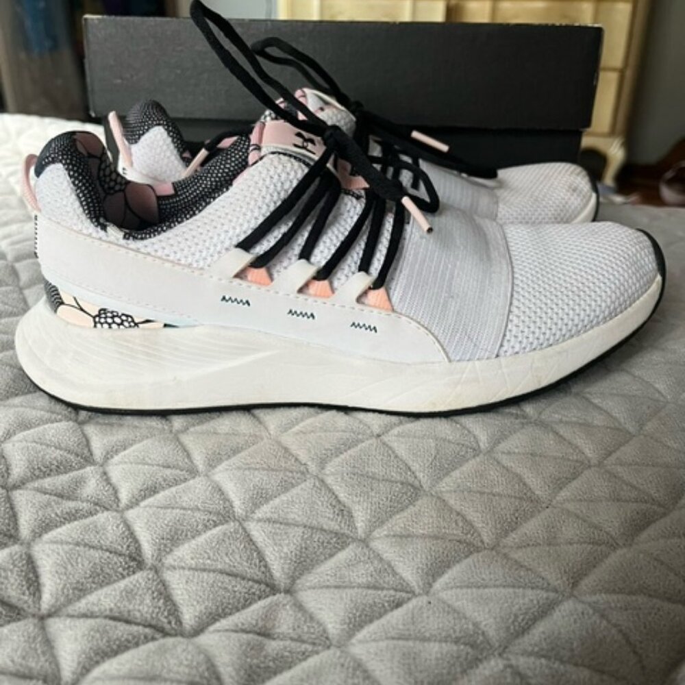 White, pink, and floral size 8.5 Under Armour shoes